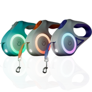 Three colorful retractable dog leashes on a white background.