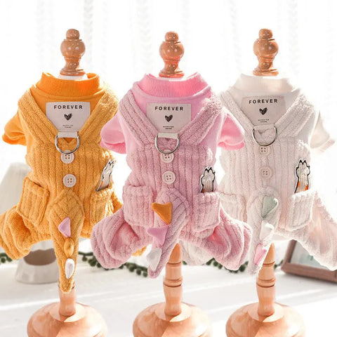 Three mannequins wearing colorful pet outfits with 'FOREVER' labels.