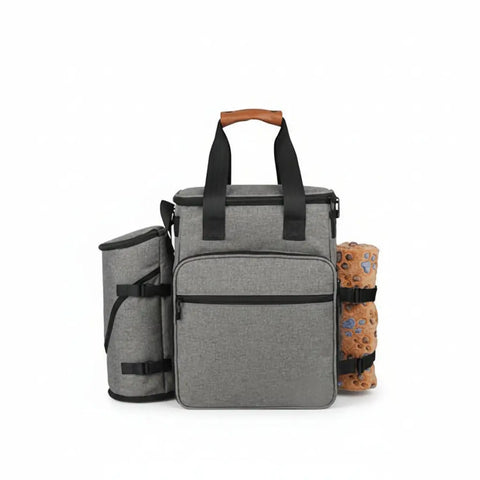 Travel pet organizer bag with compartments and collapsible bowls.