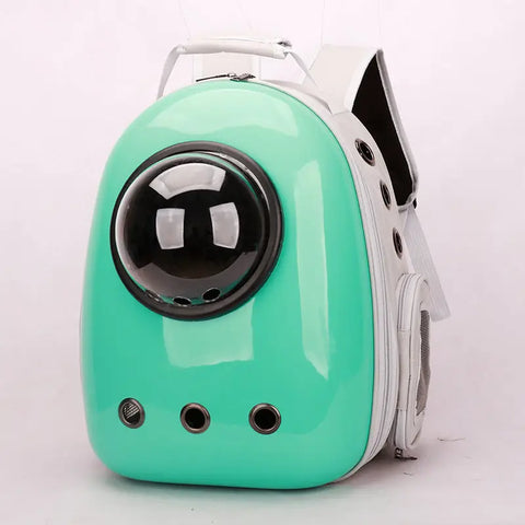 Turquoise pet carrier with a black window on white background.