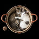 Two cats in round wicker pet bed with text on dark background.