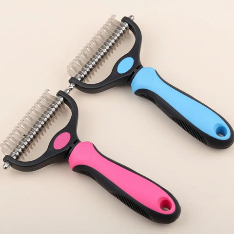Two pet grooming tools with pink and blue handles on gray background.