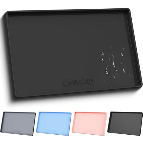 Sleek black Ukeetap waterproof silicone pet food tray with water droplets, featuring a clean minimalist design.