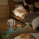 Supremely silent pet water fountain operating at 25 decibels next to a sleeping cat and person reading.