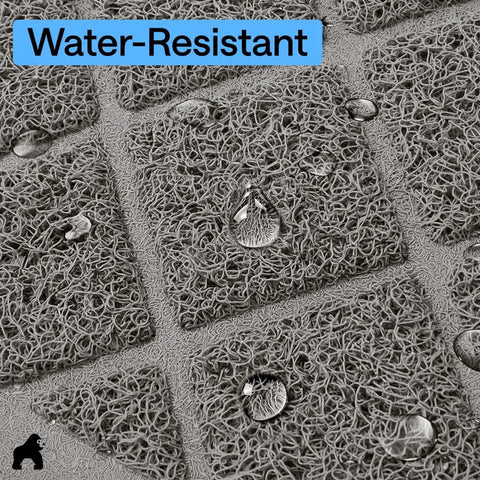Close-up of water droplets sitting on top of a water-resistant mesh cat litter mat