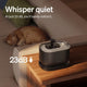 Ultra-quiet 23dB pet water fountain on a side table next to a sleeping ginger tabby cat