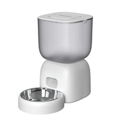 White pet food dispenser with a stainless steel bowl on a white background