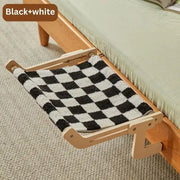 Wooden cat hanging bed for a balcony with a black and white checkered fabric hammock
