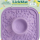 Woof LickMat 2-in-1 purple dog slow feeder mat and interactive enrichment toy in retail packaging.