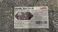 Sealed plastic product packaging for WOUSEDO Chenille Dog Towels in grey, showing the care instructions, barcode, and product specifications label.
