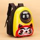 Yellow pet backpack with a daruma design on beige background.