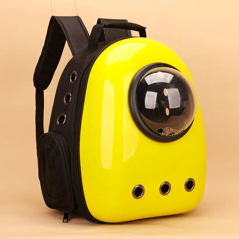 Yellow pet backpack with a transparent dome on a beige background