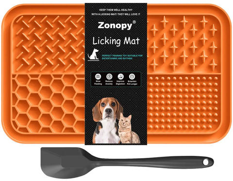 Zonopy 4-quadrant textured silicone dog lick pad in vibrant orange with a black spatula.